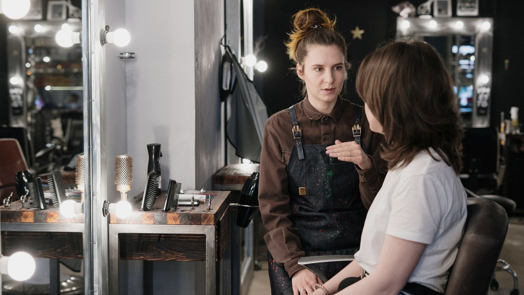 Styling stations with lit mirrors inside the salon